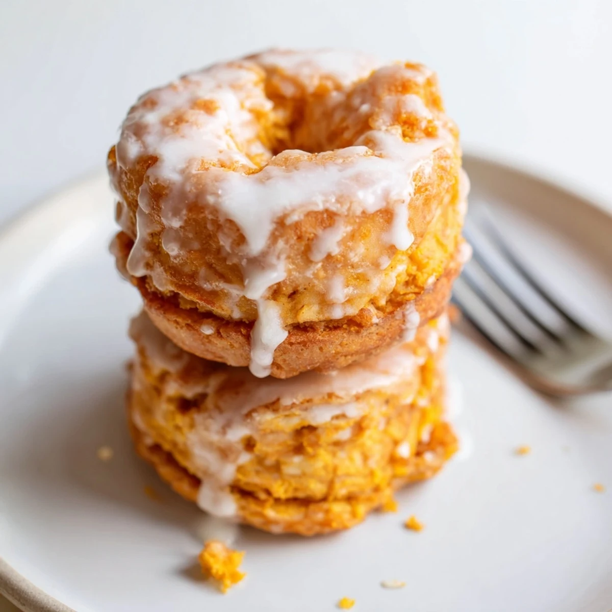 Homemade flaky sweet potato donuts, warm and inviting, ideal for dessert lovers.