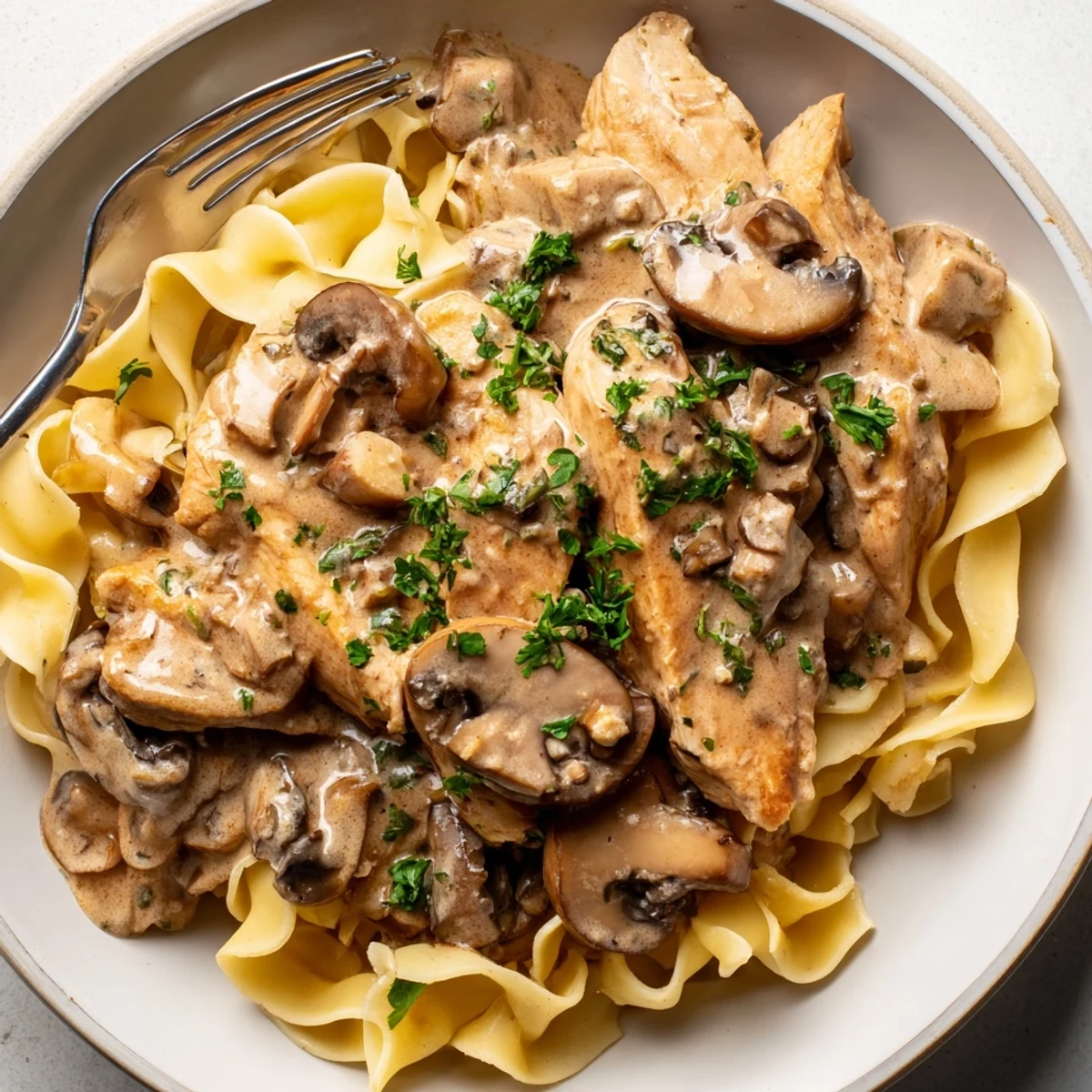 Delicious Creamy Chicken Stroganoff with tender chicken and rich mushroom sauce, ready to enjoy.  