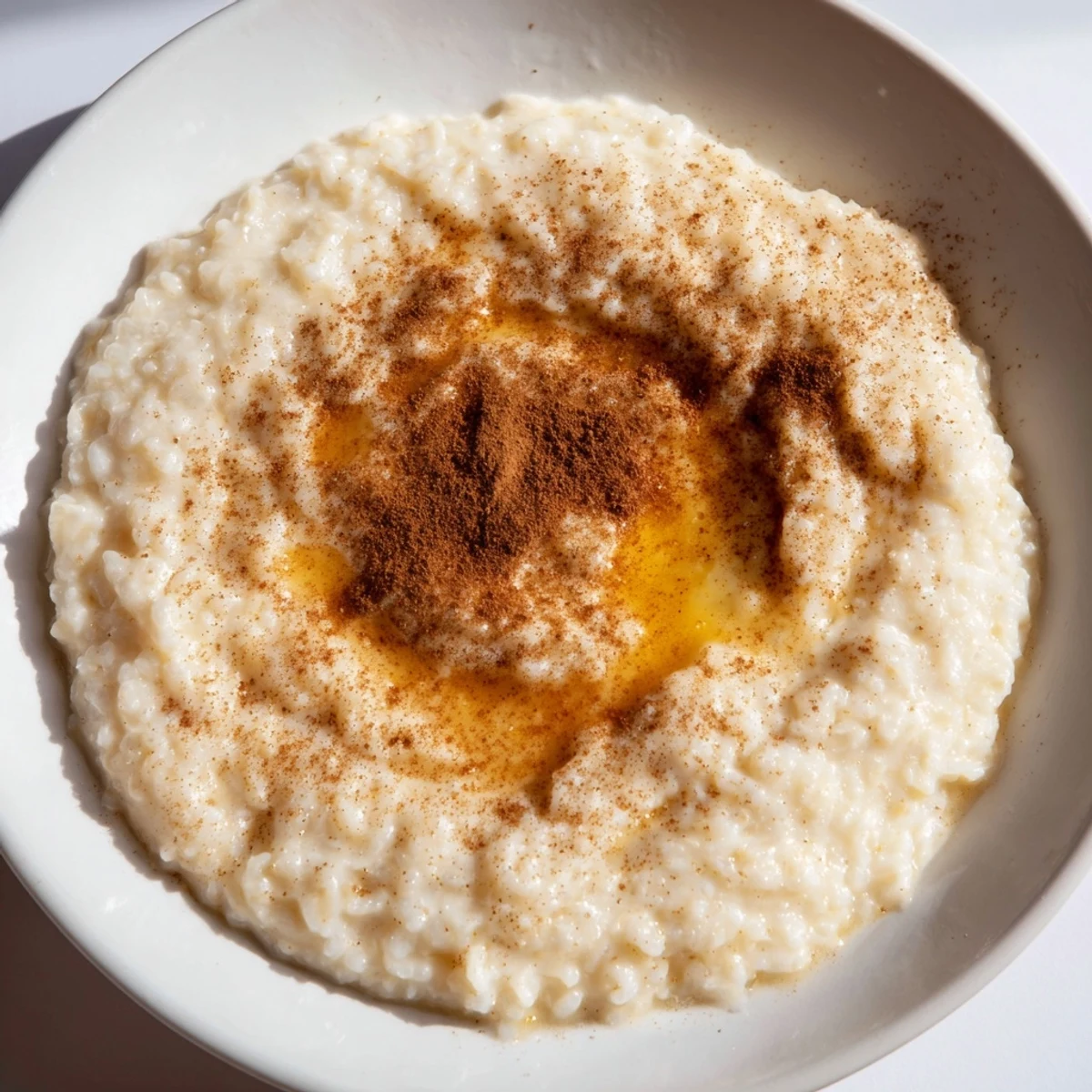 Close-up of comforting rice pudding, enriched with vanilla, offering a sweet treat using leftover rice.