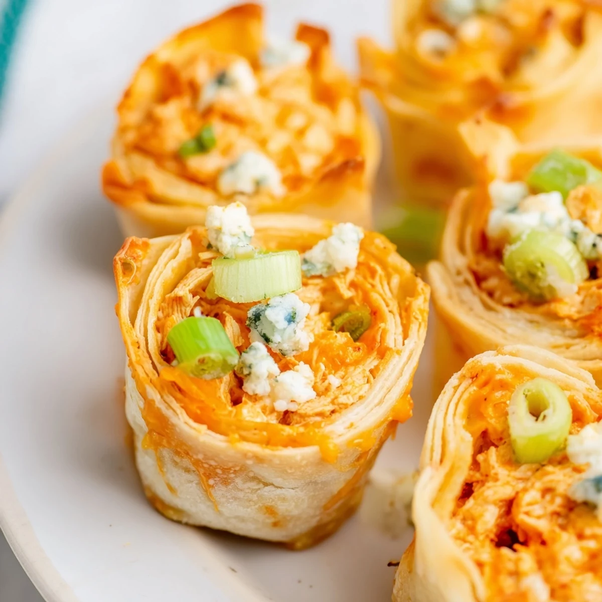 Savory Buffalo Chicken Dip Pinwheel Wontons: a game-day favorite with a spicy chicken filling.