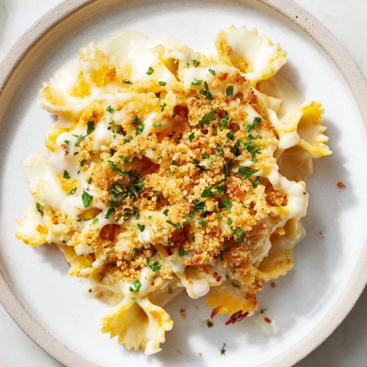 A close-up of a creamy Lightened Mac & Cheese Snowflake Pasta Bake, ready to serve and enjoy.