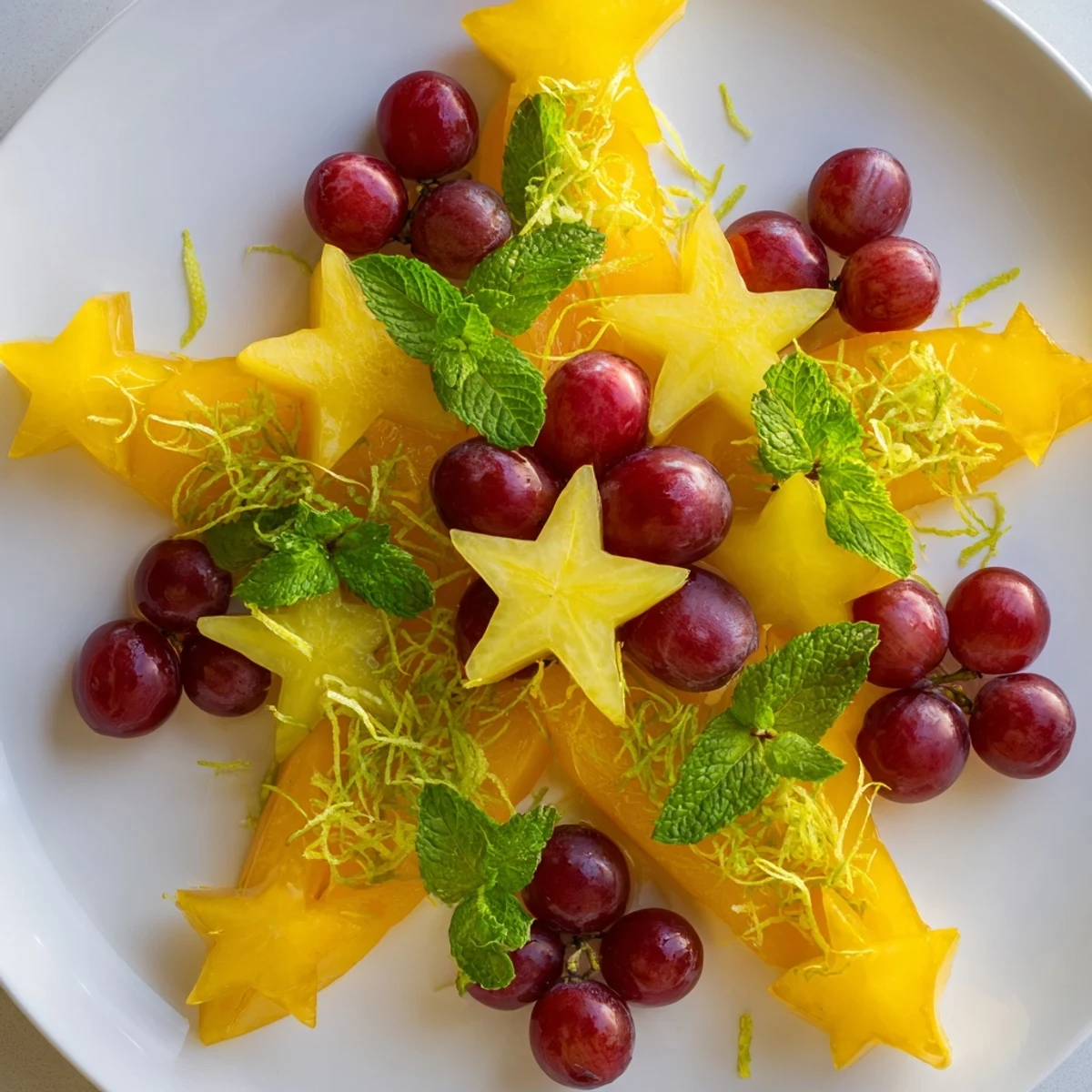 Fresh, juicy starfruit and grape slices elegantly arranged, making a perfect brunch fruit presentation.