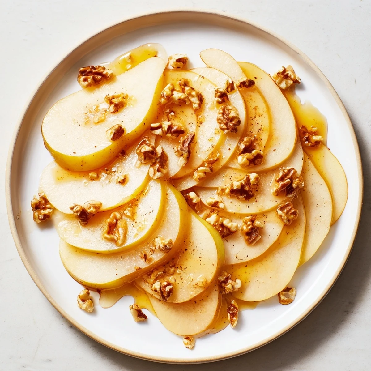 Sweet pear slices topped with honey, ready to serve as a quick and lovely dessert.