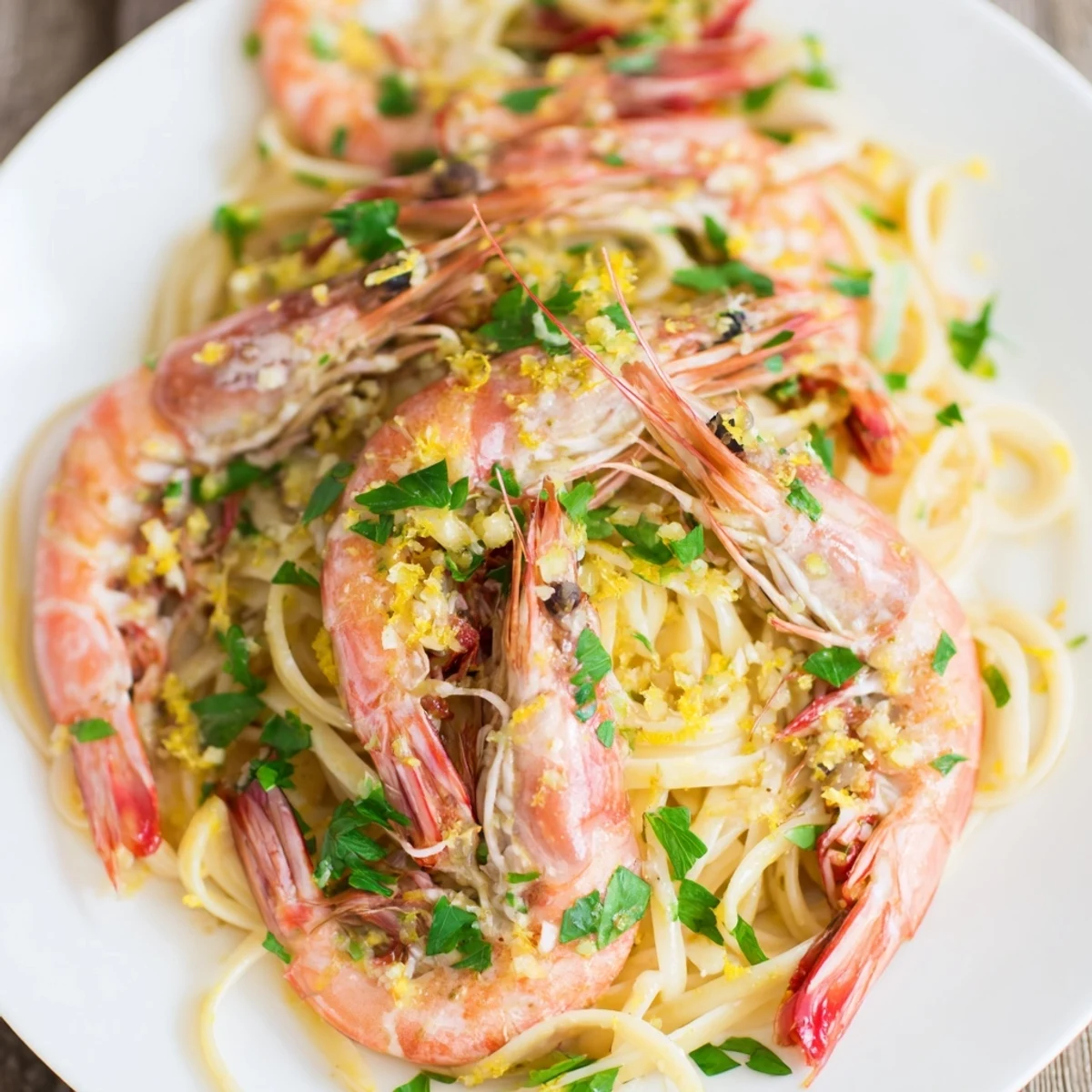 A close-up view of Garlic Butter Shrimp Linguine featuring al dente pasta strands tossed with succulent shrimp and a buttery garlic sauce.