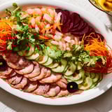 Festive Lunar New Year Dragon Platter: beautifully arranged appetizers with dipping sauces, perfect for sharing.