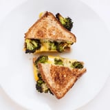 Melted sharp cheddar and roasted broccoli nestled between crispy, golden-toasted sandwich bread slices.