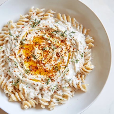 Creamy Turkish Yogurt Pasta, swirled with garlic-infused yogurt and vibrant red spiced butter.