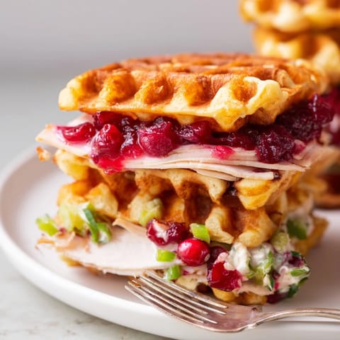 Savory turkey and sweet-spicy cranberry jalapeño dip sandwiched in mini waffles.  