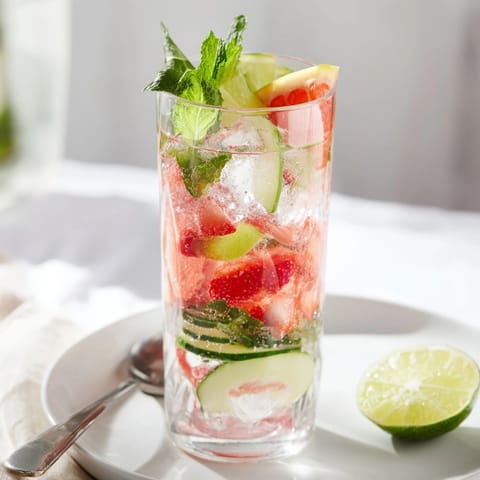 Ice-cold flavored mocktails featuring strawberries and lemons perfect for summer gatherings.  