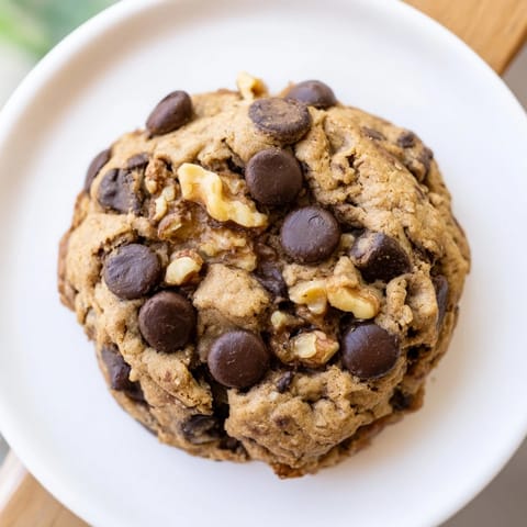 A stack of delicious chewy protein chocolate chip cookies, fresh from the oven, offering a protein boost.