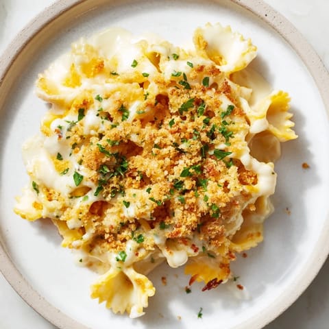 A close-up of a creamy Lightened Mac & Cheese Snowflake Pasta Bake, ready to serve and enjoy.