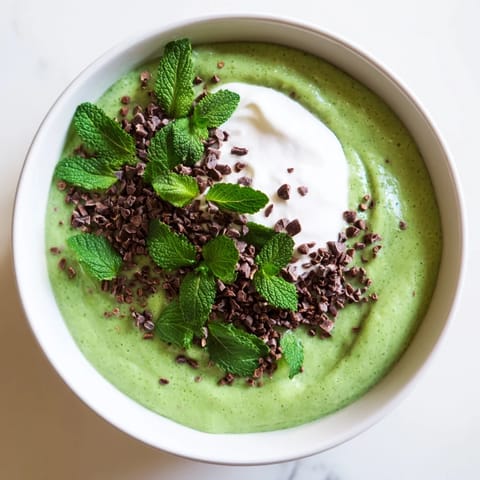 Vibrantly green Grinch Green Mint Matcha Breakfast Chia Pudding, chilled overnight for a refreshing vegan treat.
