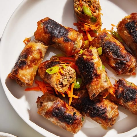 Close-up of freshly air-fried Chicken Lumpia Bites, showcasing a perfect golden brown color and texture.