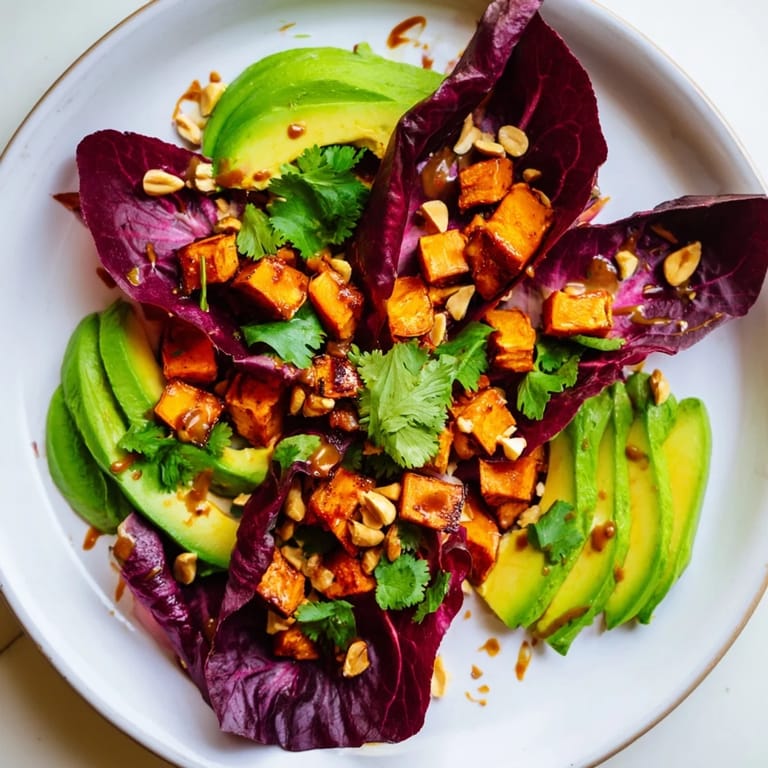 A vibrant Spiced Peanut Sweet Potato & Radicchio Salad Bowl with fresh ingredients—a perfect vegetarian meal.