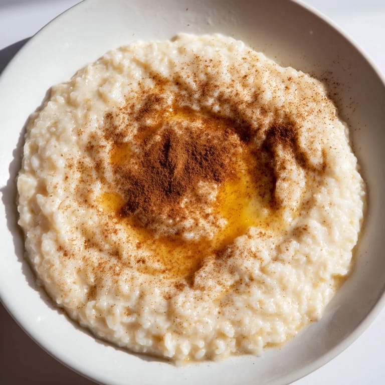 Close-up of comforting rice pudding, enriched with vanilla, offering a sweet treat using leftover rice.