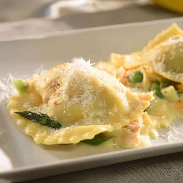 A close-up shot of a warm Chicken Pot Pie Ravioli Bake, perfect comfort food, ready to serve.