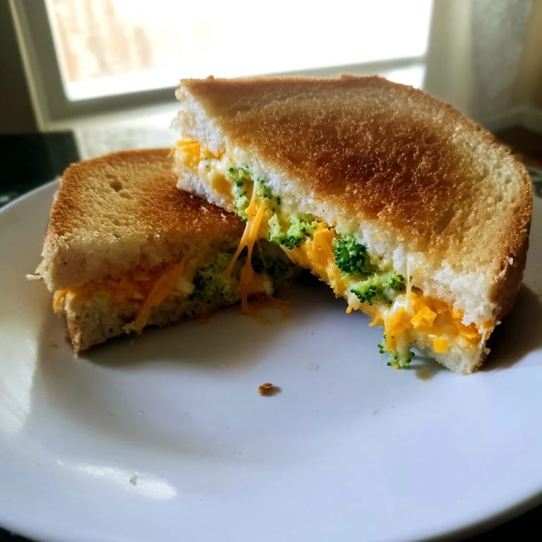 Crispy, cheesy goodness: imagine the delightful Air Fryer Broccoli Cheddar Stuffed Grilled Cheese, perfectly cooked.