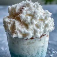Fluffy TikTok Cloud Slushie with lemon-lime soda and condensed milk, served in tall glasses with straws.